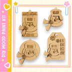 four wooden ornaments, each with a unique design and a winter theme. The ornaments are shaped like a snowman, a snowman with a hat, a snowman holding a snowflake, and a snowman wearing a scarf. The ornaments are displayed against a pink and yellow background, which complements the winter theme.