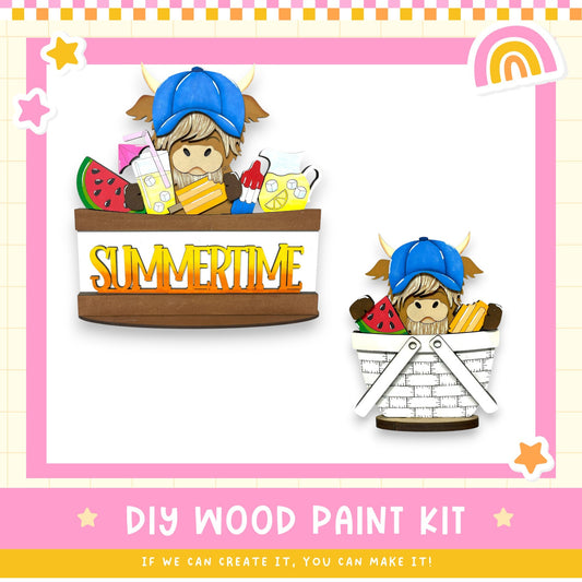 The image is a colorful illustration of a DIY wood paint kit, featuring a cartoon character wearing a blue hat and holding a basket filled with various summer-themed items such as watermelon, lemon, and a rainbow.