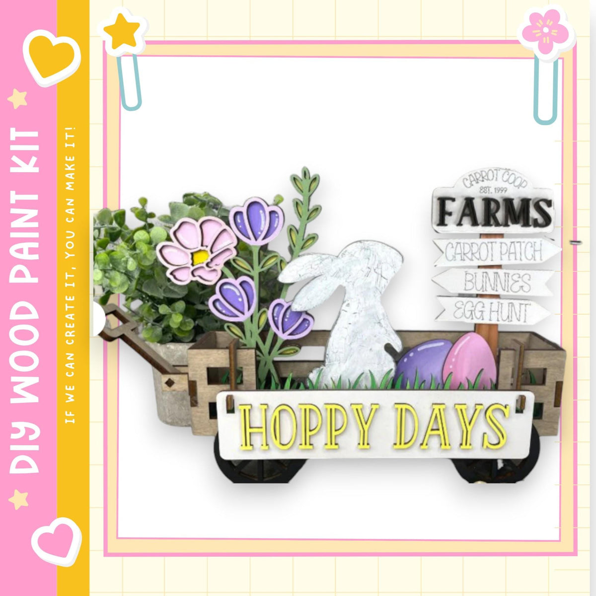 a wooden wagon filled with various Easter-themed decorations, including a bunny, flowers, and eggs. The wagon is labeled "HOPPY DAYS" and is surrounded by a pink and yellow border.