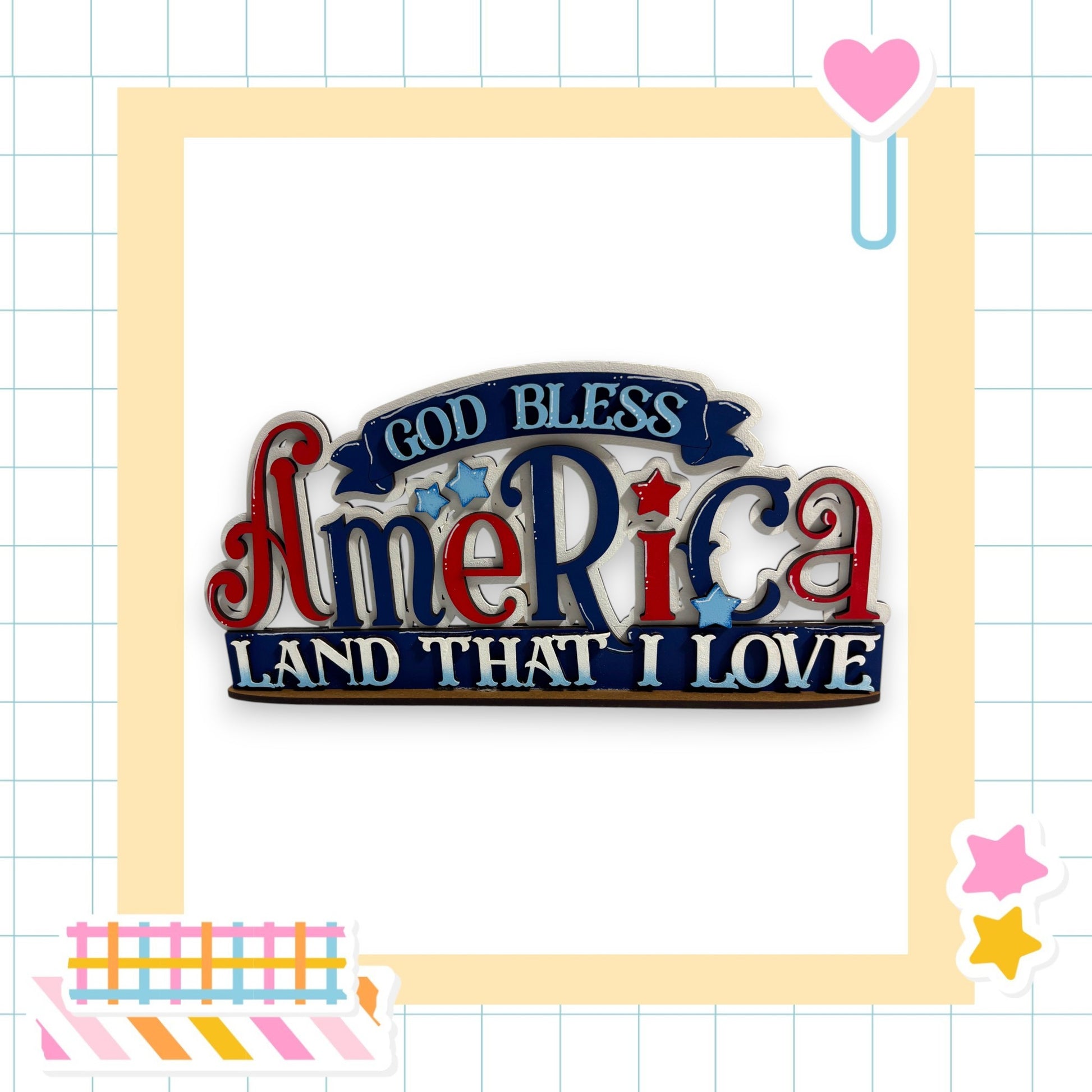 a patriotic-themed sign with the text "God Bless America Land That I Love" in a decorative font.