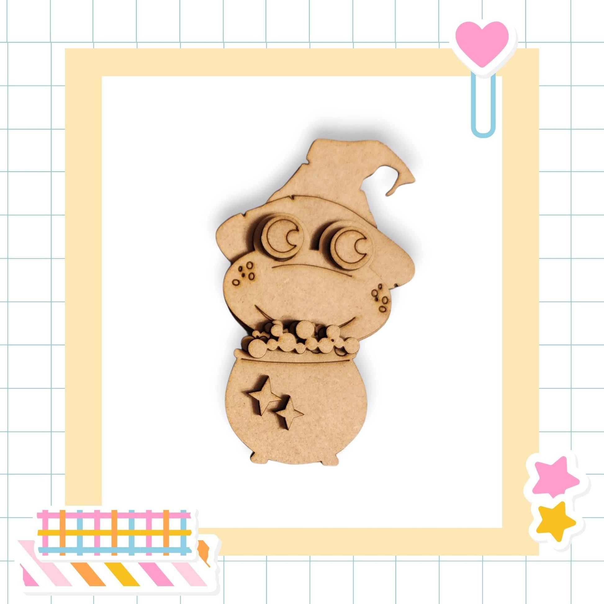 A wooden toy resembling a small, cartoonish creature with a pointed hat and star-shaped cutouts on its body, set against a grid background with various colorful stickers and a heart-shaped object.