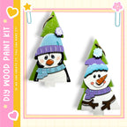 two snowman ornaments, one with a blue scarf and the other with a purple scarf, both wearing winter hats and smiling.