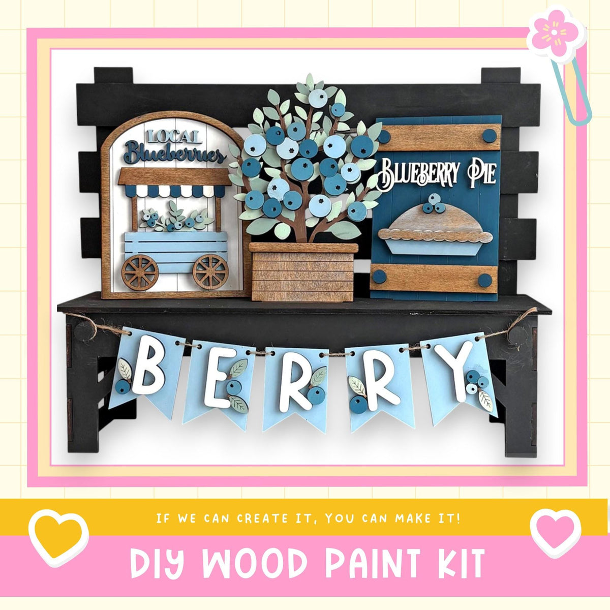 The image is a DIY wood paint kit for creating a berry-themed display, featuring a wooden sign, a wooden wagon, and a wooden pie.