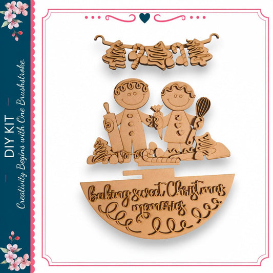 The image is a wooden craft depicting two smiling figures, likely representing a couple, with various baking-related items such as a cookie sheet, a cake, and a whisk. The craft is set against a white background and includes text that reads "DIY KIT" and "baking memories".