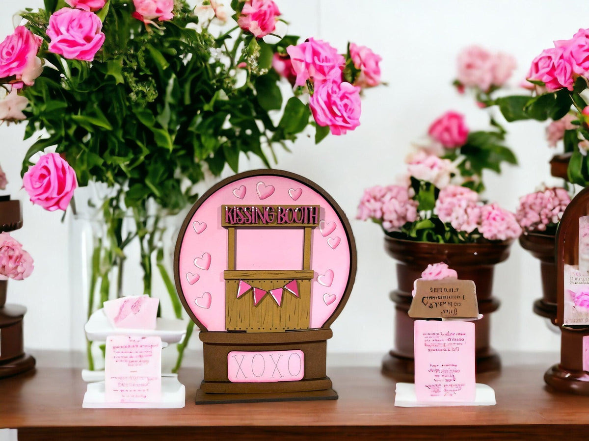 a table topped with pink flowers and vases filled with pink flowers