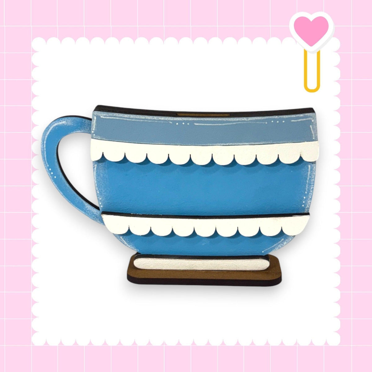a blue and white coffee cup on a wooden stand