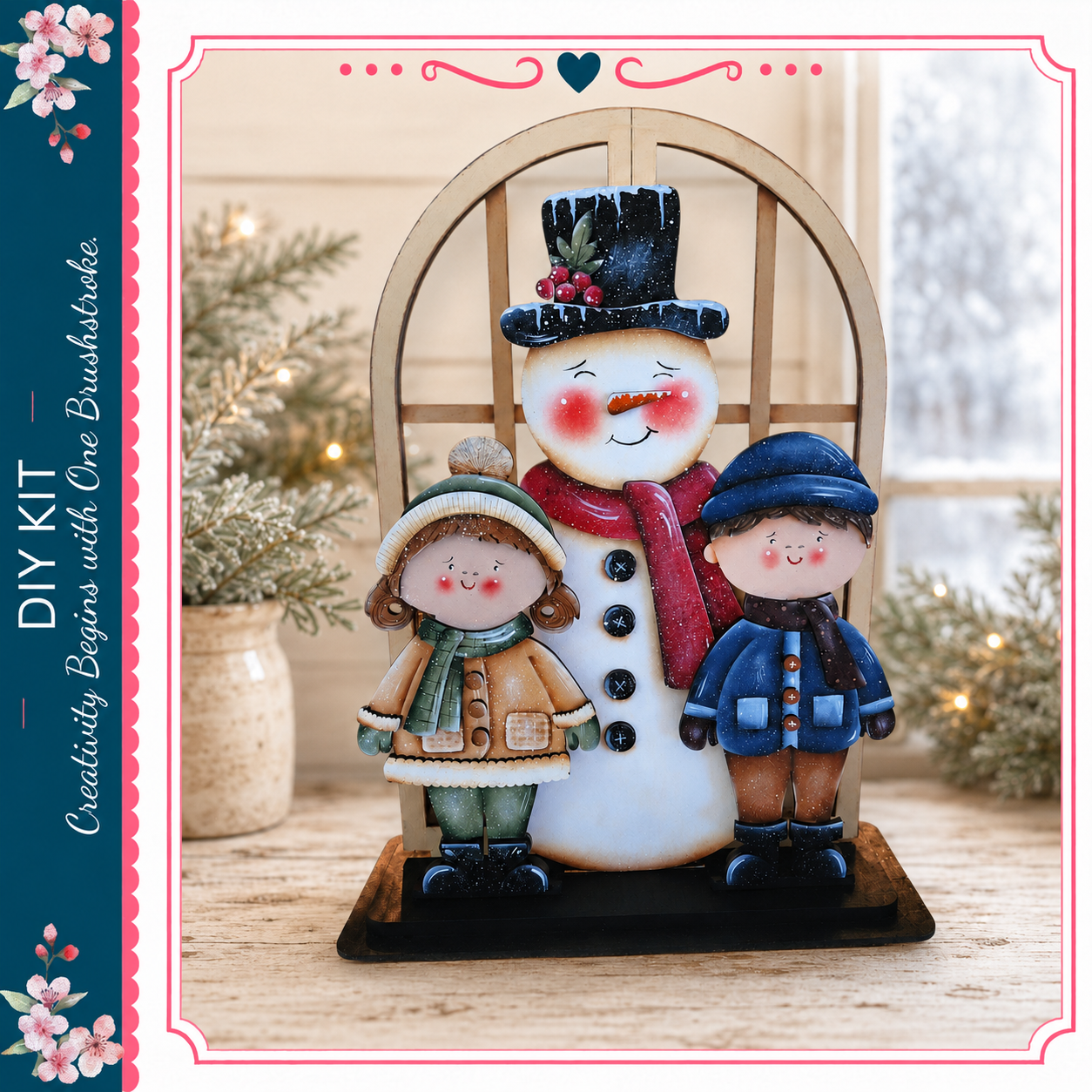 A wooden snowman figure with two children standing beside it, set against a backdrop of a window and pine trees.