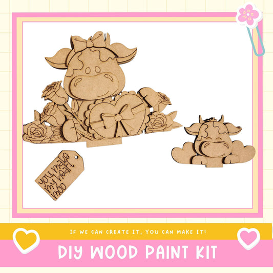 a DIY wood paint kit with a wooden cow and heart-shaped decorations. The kit appears to be made of wood and includes a heart-shaped decoration.