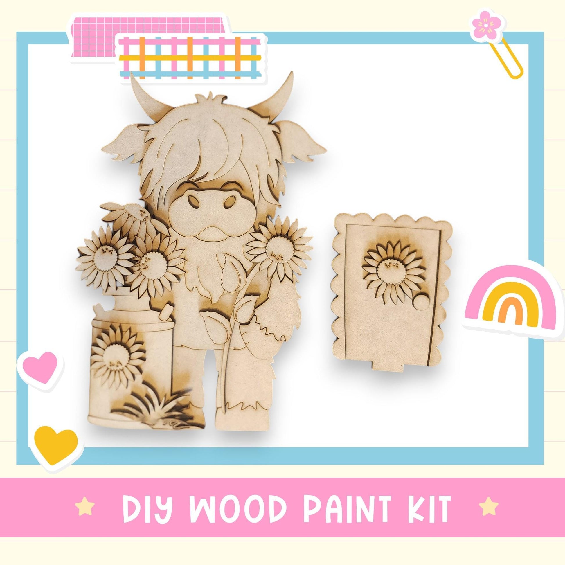 The image is a DIY wood paint kit featuring a wooden cow holding flowers, with a rainbow and hearts as decorative elements.