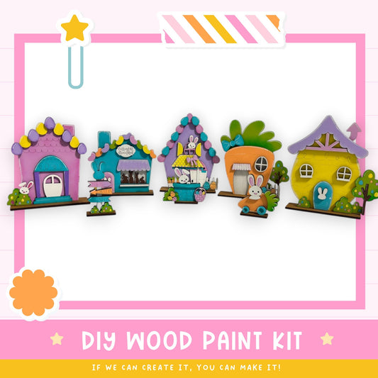 a DIY wood paint kit for creating colorful wooden houses, with a variety of whimsical and charming designs.