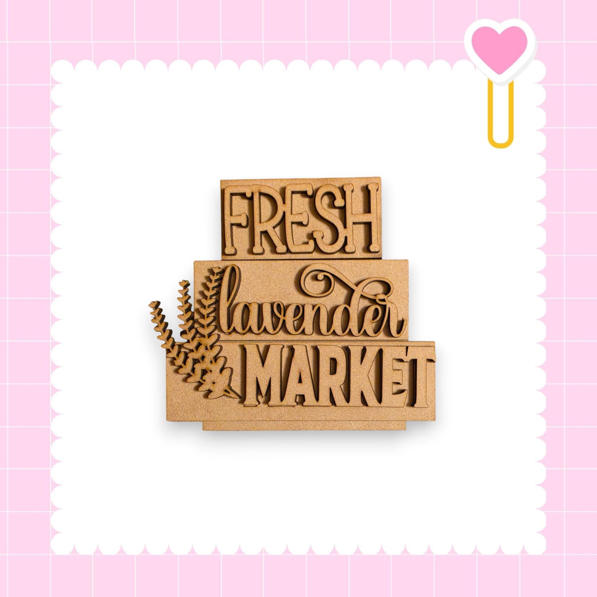 a wooden sign with the text "FRESH lavender MARKET" carved into it, set against a pink background with a scalloped edge.