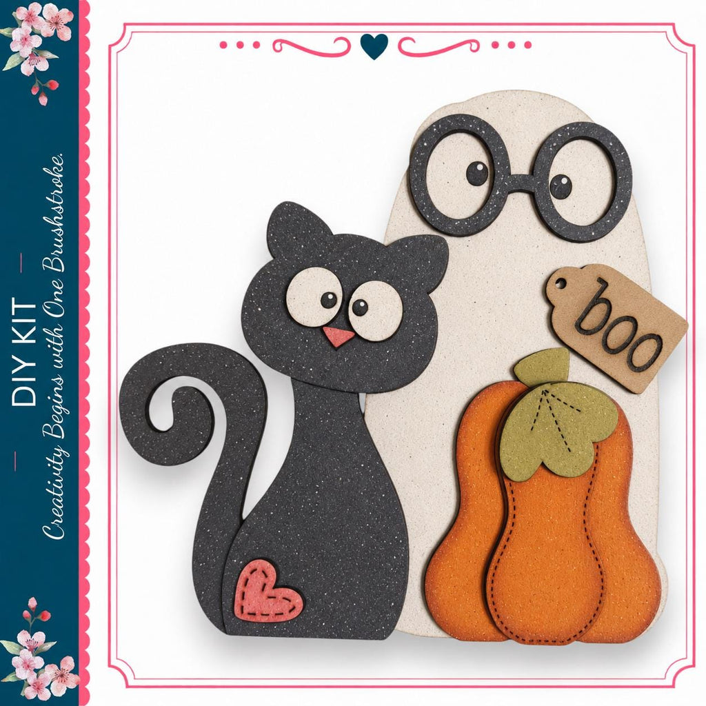 a black cat, a wooden pumpkin, and a wooden ghost with a "boo" tag attached to it, all set against a white background.