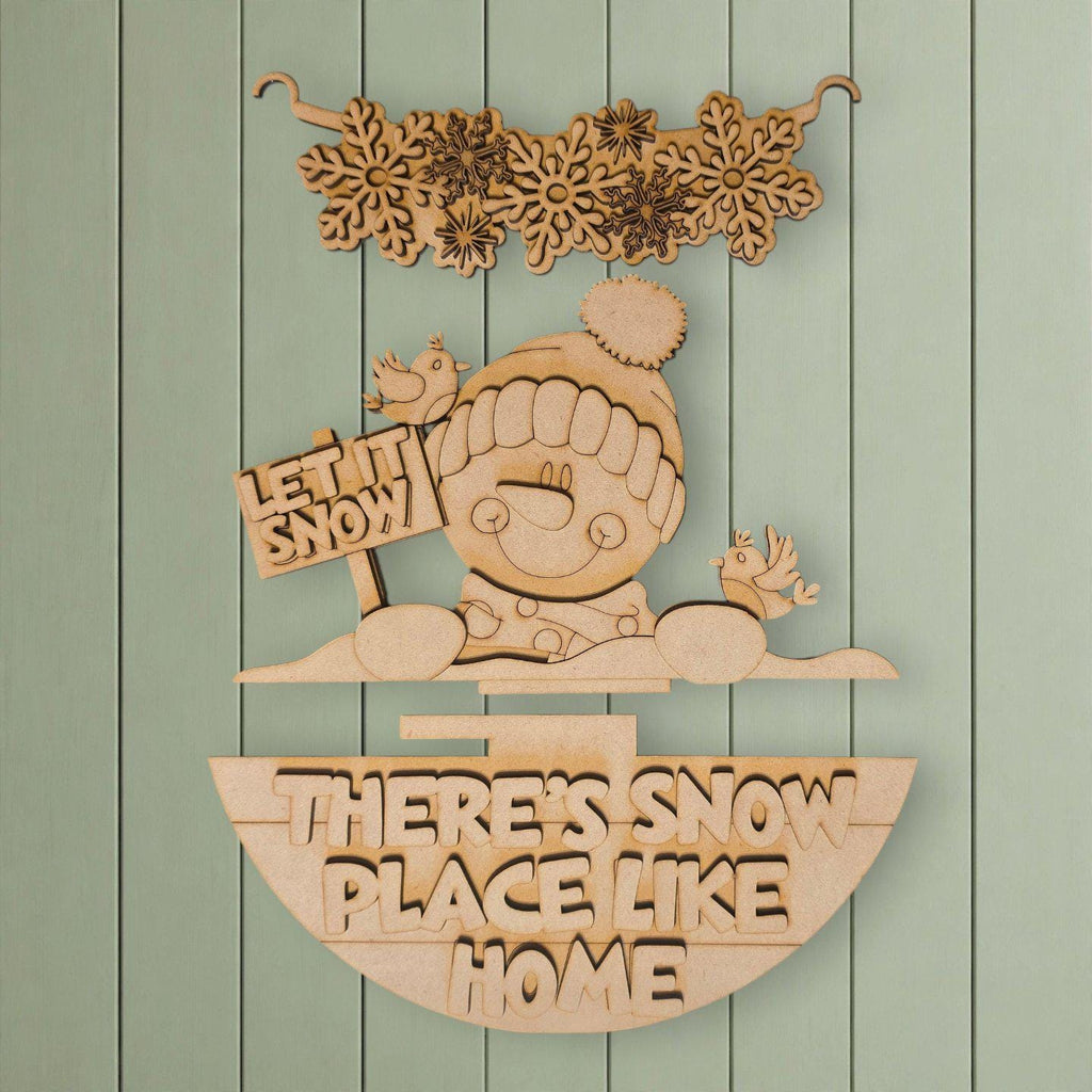 A wooden sign with the text "LET IT SNOW PLACE LIKE HOME" and a snowman figure, along with snowflakes and birds, is displayed against a light green background.