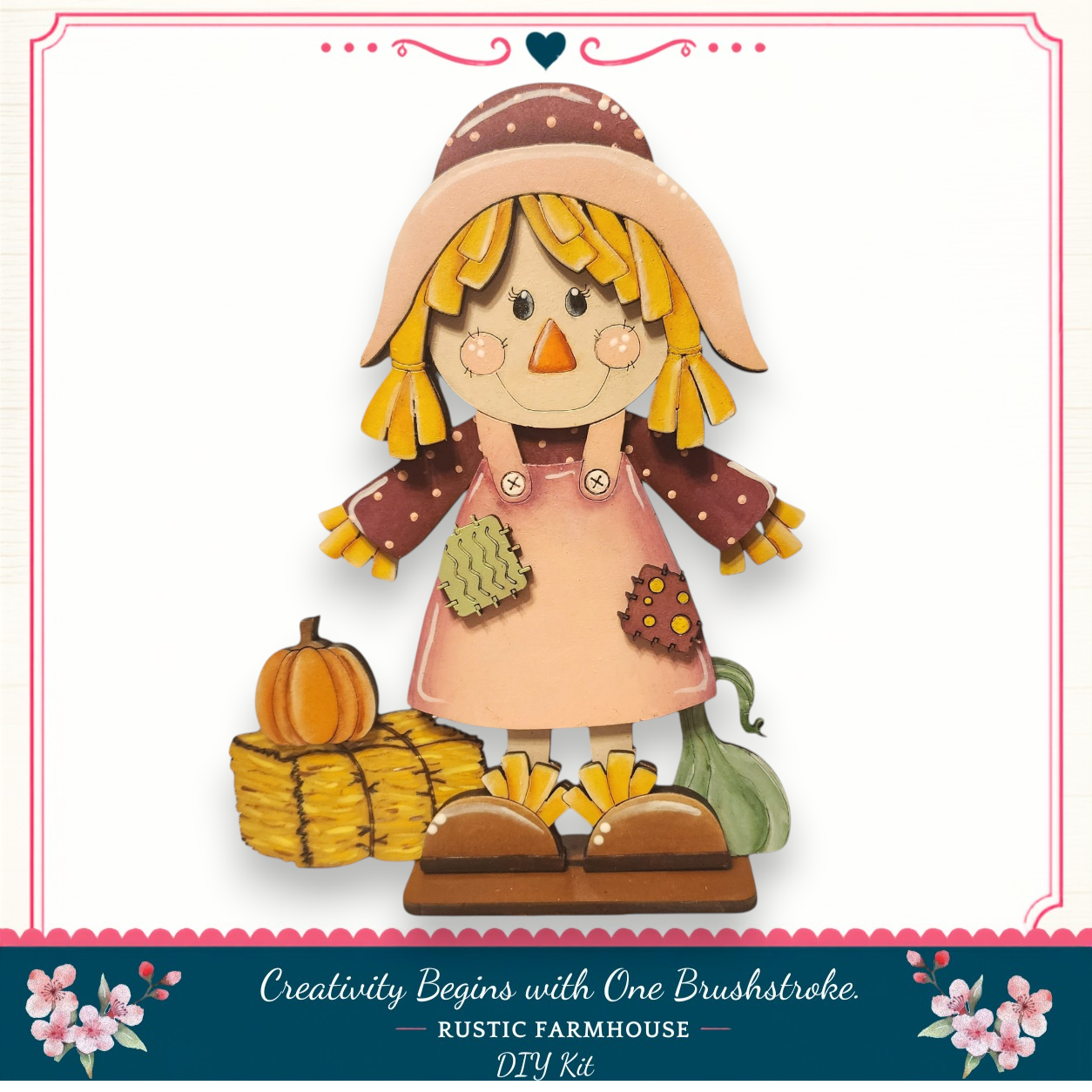 A hand-painted scarecrow figure with a pumpkin and hay bales, set against a white background with a decorative border.