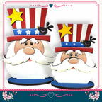 two cartoon-like Santa Claus figures wearing patriotic hats with stars and stripes, and a small bird perched on one of the Santa Claus figures.