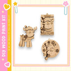 three wooden ornaments, including a moose, a snowflake, and a Christmas tree, all of which appear to be made of wood and are displayed against a white background.