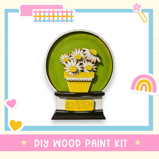 a DIY wood paint kit for creating a wooden snow globe with a vase of daisies.