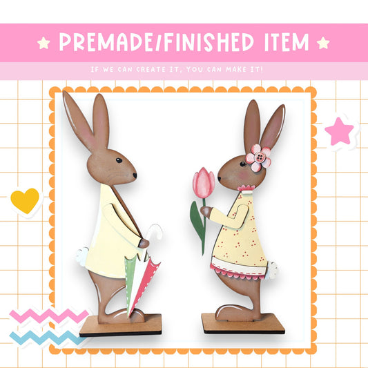 a couple of rabbits standing next to each other