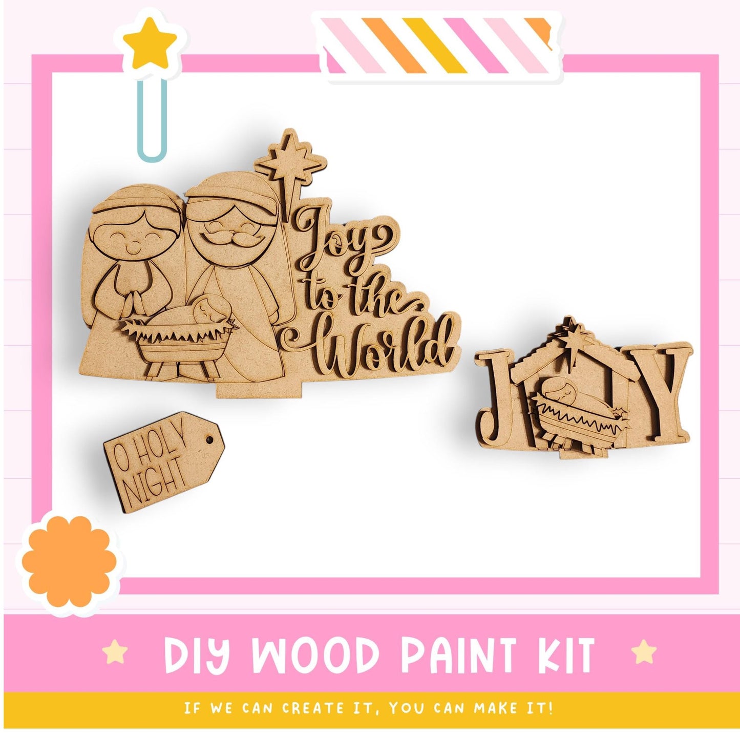 The image is a DIY wood paint kit featuring a nativity scene with a baby in a manger, a wooden sign with the phrase "Joy to the World", and a wooden tag that says "O Holy Night".