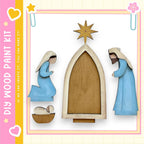 The image is a collage featuring a nativity scene with a wooden frame, a wooden star, and two wooden figures dressed in blue.