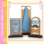a Father's Day-themed display with a blue tie, a pair of glasses, and a bow tie, all arranged on a wooden stand.