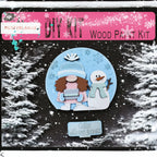 The image is a DIY kit for a wood paint kit, featuring a snowman and a gnome against a snowy background.
