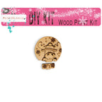 a wooden pin with a picture of a girl on it