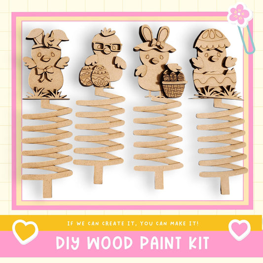 a DIY wood paint kit with four wooden Easter egg ornaments, each with unique designs and decorations.