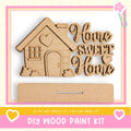 a DIY wood paint kit with a wooden house and the phrase "Home Sweet Home" written on it.