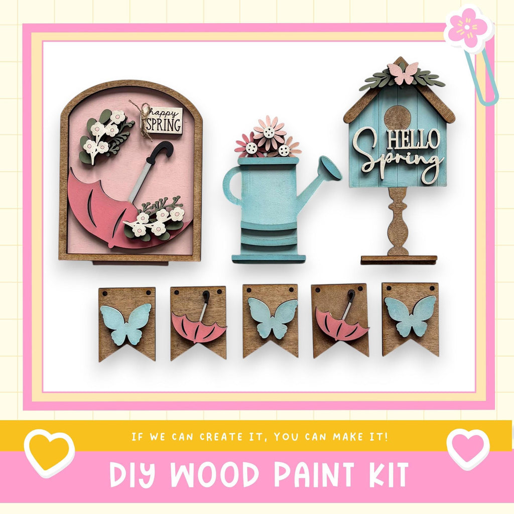 The image is a DIY wood paint kit featuring various spring-themed items such as a birdhouse, a watering can, and butterflies. The kit appears to be made of wood and includes a sign that says "Hello Spring". The kit is designed for people to create their own spring-themed decorations and home accessories.