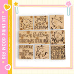 a collection of six wooden cutouts depicting snowmen and Christmas-themed designs, arranged in a grid-like pattern.