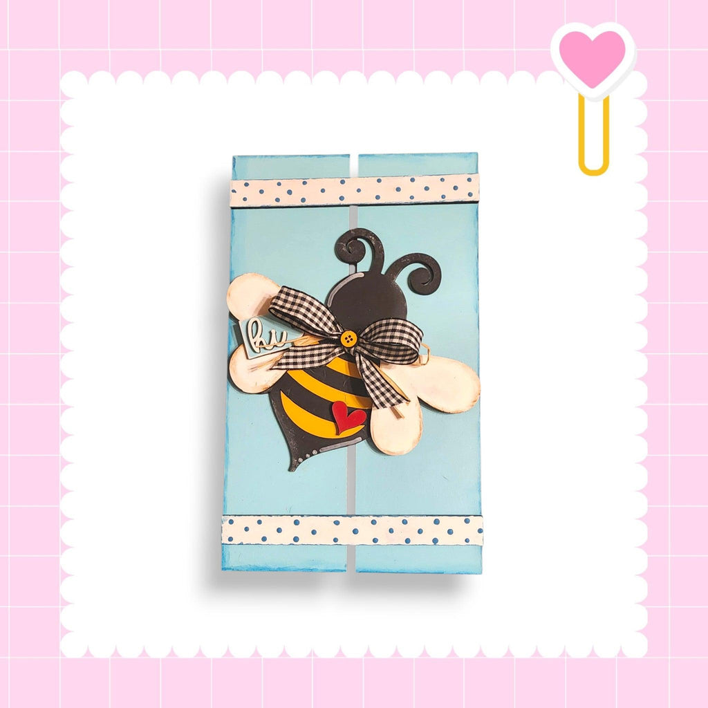 a piece of paper with a bee on it