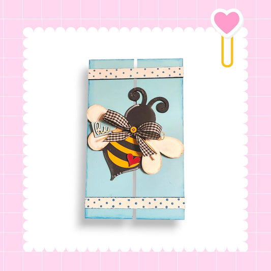 a piece of paper with a bee on it