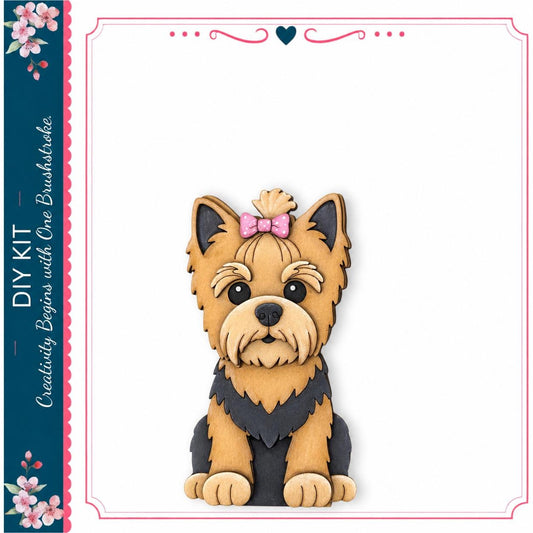 A wooden cutout of a small dog with a pink bow on its head, sitting on a white background.