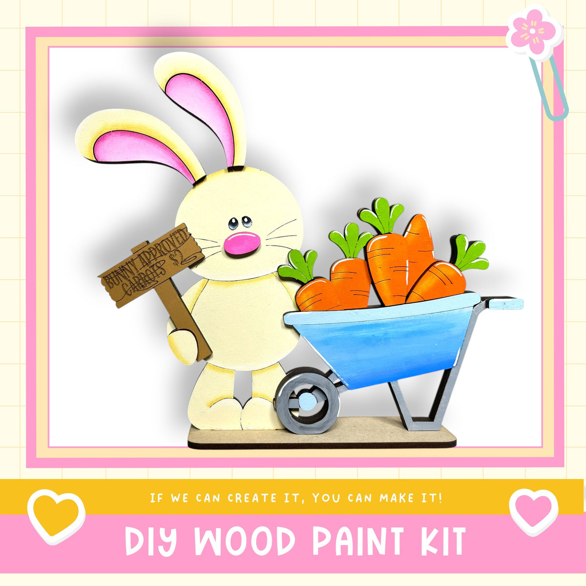 A wooden bunny holding a sign and a wheelbarrow filled with carrots, with the text "DIY WOOD PAINT KIT" and "If we can create it, you can make it!"