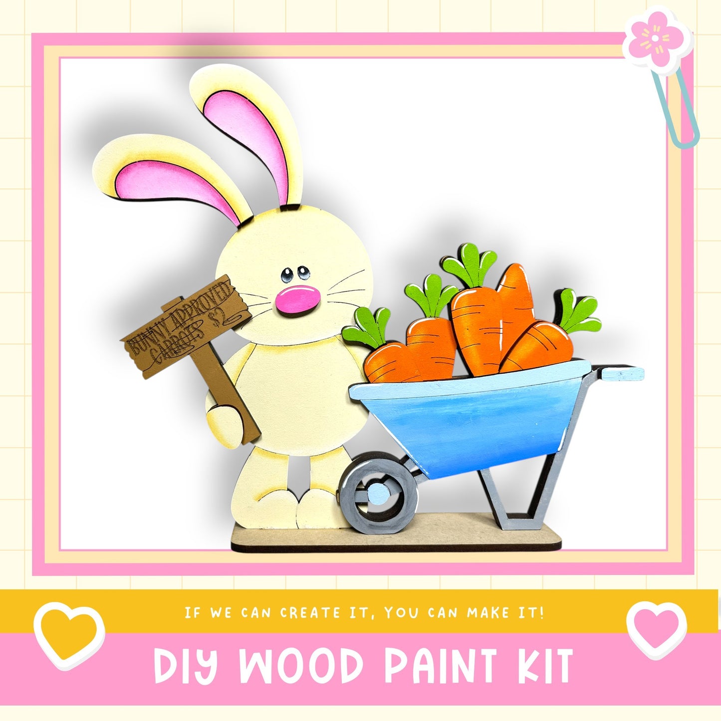 A wooden bunny holding a sign and a wheelbarrow filled with carrots, with the text "DIY WOOD PAINT KIT" and "If we can create it, you can make it!"