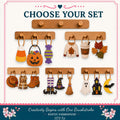 The image is a collage of various Halloween and fall-themed items, including a candy corn, a jack-o-lantern, a sweater, a coffee cup, autumn leaves, a witch's broom, a ghost, a witch's hat, a pumpkin, a scarf, a boot, and a bat. The items are displayed on wooden hangers, and the text "Choose Your Set" is prominently featured at the top of the image.