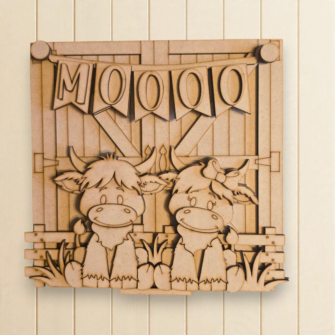 A wooden sign with a cartoon cow and the word "Moo" written on it.
