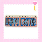 a pink background with a decorative border and a heart-shaped object on the right side. The central focus of the image is a sign that says "Happy Easter" in blue letters.