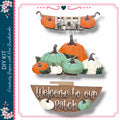 a collection of fall-themed elements, including pumpkins, leaves, and a wooden sign. The pumpkins are of various sizes and colors, and the leaves are scattered around them. The wooden sign reads "Welcome to our Patch".