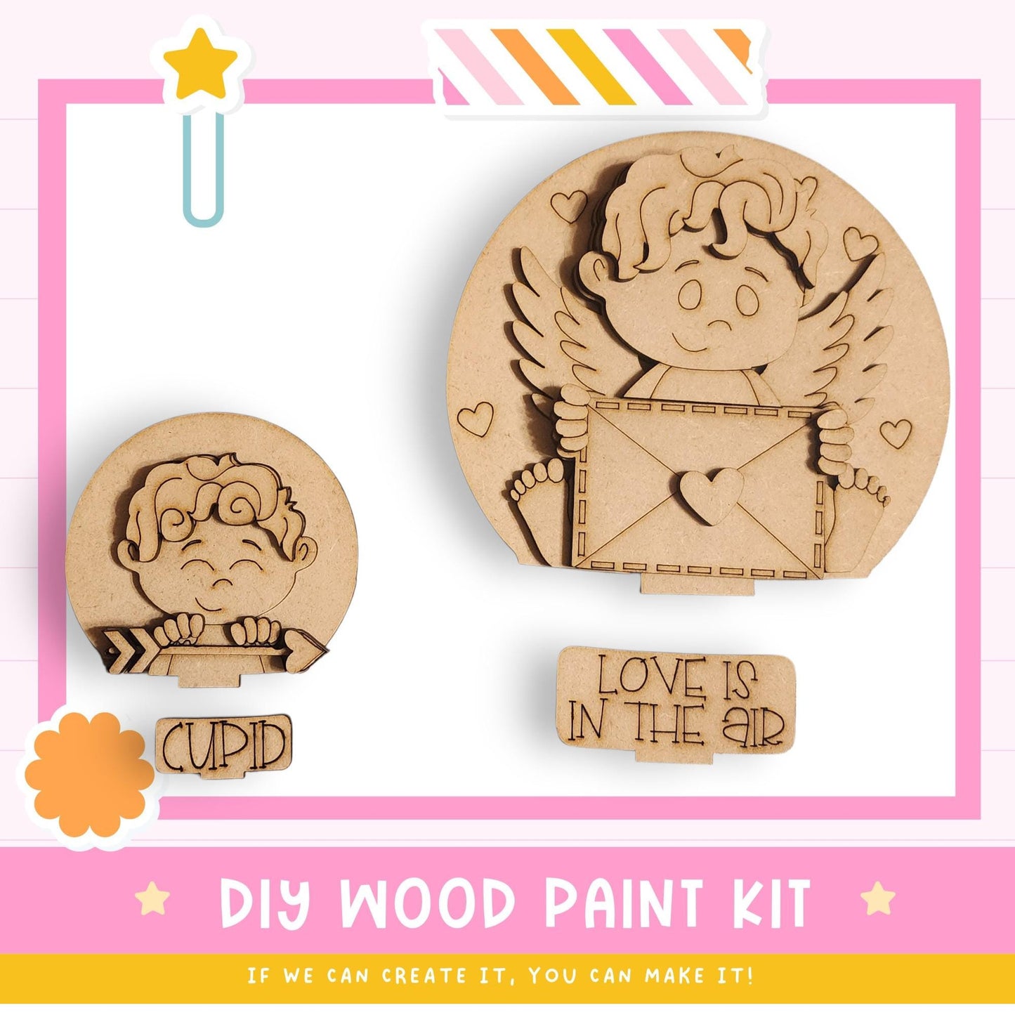 The image is a promotional poster for a DIY wood paint kit, featuring two wooden cutouts of cherubs and an envelope. The poster emphasizes that the kit allows for creativity and encourages viewers to create their own designs.