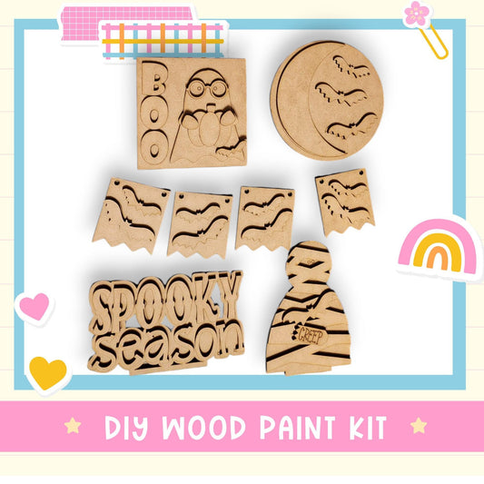 a wooden craft kit with a rainbow in the background