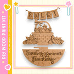 a wooden basket filled with strawberries, with the word "Sweet" written above it.
