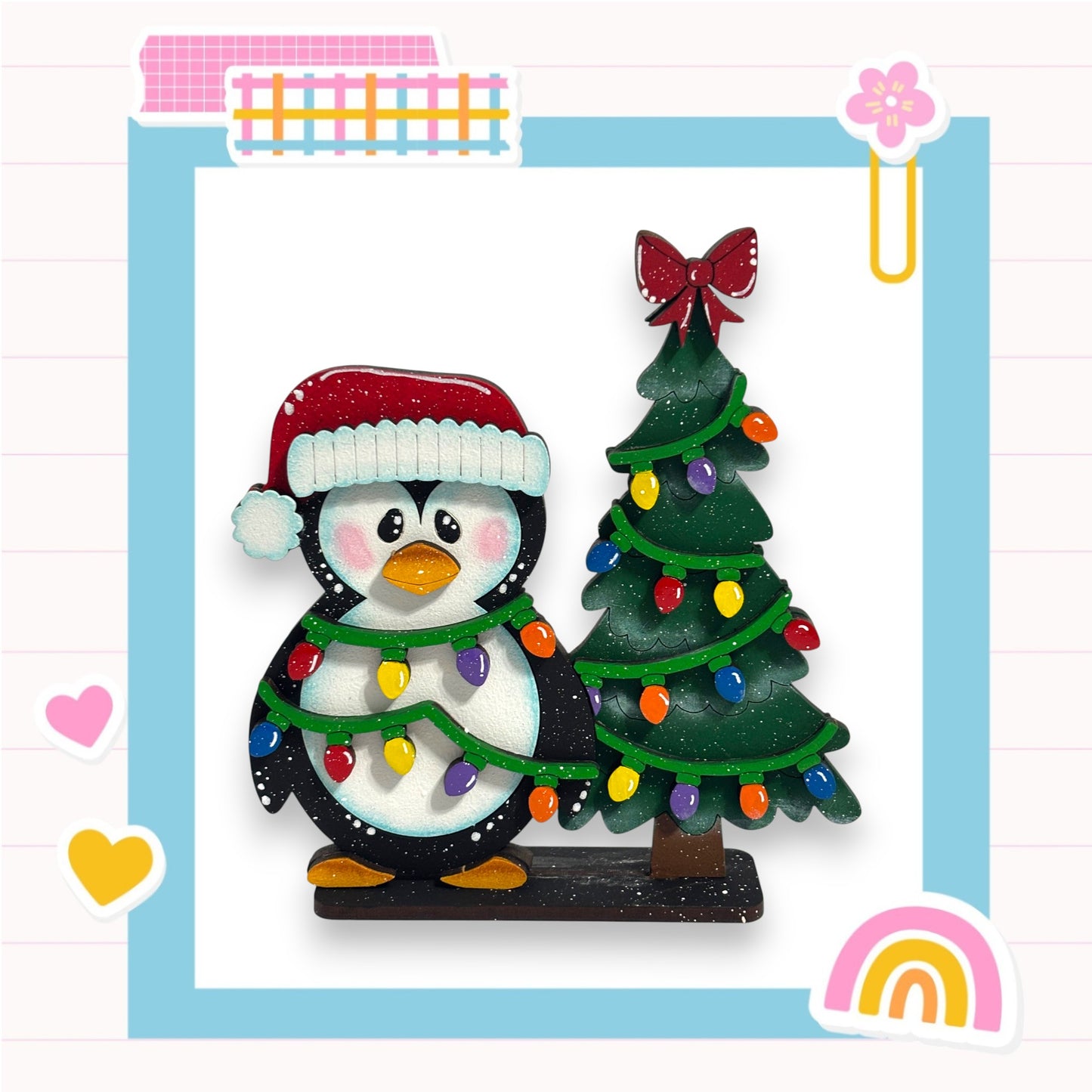 A penguin wearing a Santa hat stands next to a decorated Christmas tree, surrounded by colorful lights and hearts.