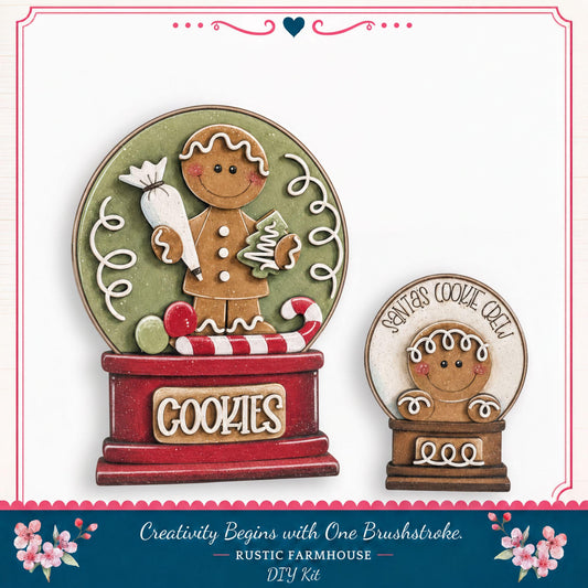 two gingerbread man figurines, one larger and one smaller, both holding candy canes and surrounded by a red and green snow globe. The larger snow globe has the word "Cookies" written on it, and the smaller one has the phrase "Santa's Cookie Crew" written on it. The snow globes are set against a white background, and there is a decorative border around the image.