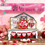 a valentine's day kit with hearts and a barn
