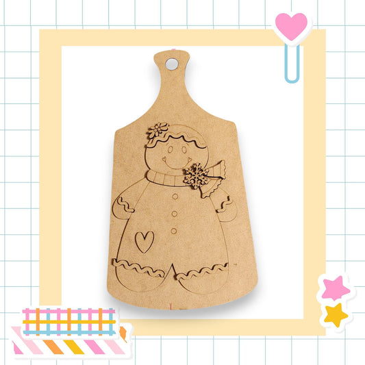 A wooden cutting board with a gingerbread man figure on it, surrounded by various colorful stickers and a heart-shaped object.