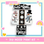 a picture of a snowman and a snowman with a rainbow in the background