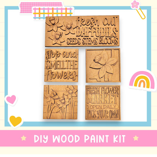 a wooden craft kit with a picture of flowers and a rainbow