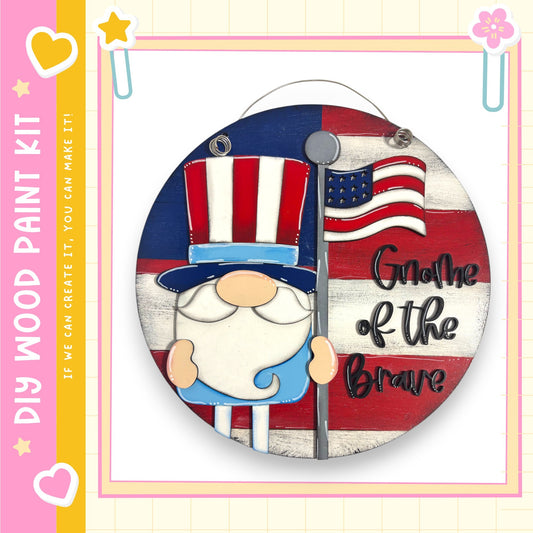 A round wooden sign featuring a gnome wearing an Uncle Sam hat and holding an American flag, with the text "Gnome of the Brave" written on it.